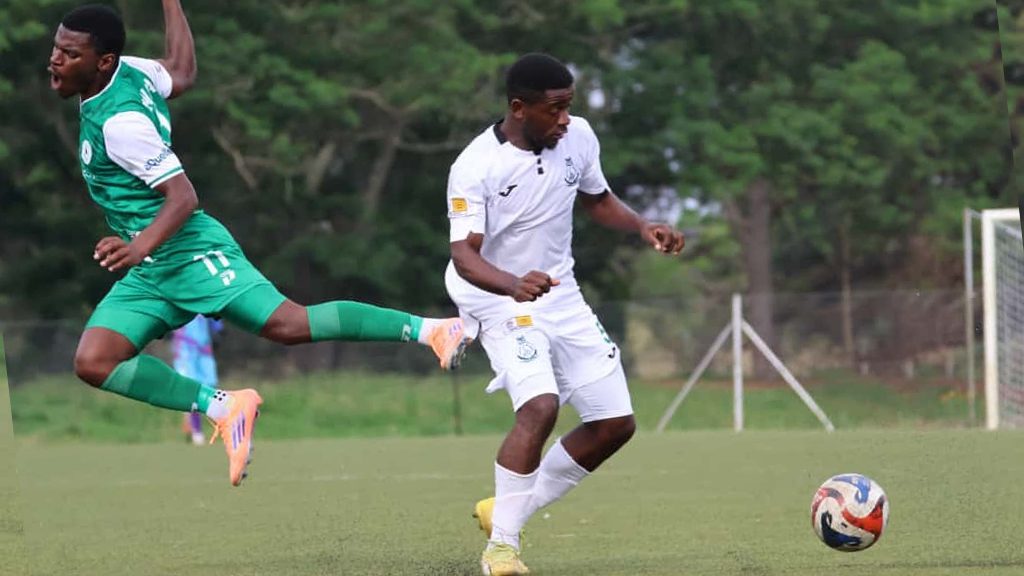 Nsingizini Hotspurs’ Kwakhe Thwala tumbles from Green Mamba defender Peter Dlamini’s tackle during their MTN Premier League clash at King Sobhuza II Memorial Stadium in Nhlangano yesterday. Green Mamba won 1-0. (Pic: Nimrod Hlophe)